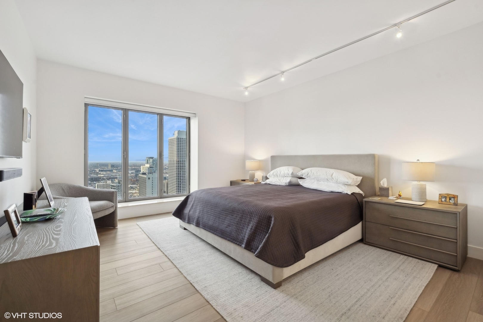 950 North Michigan Avenue, Unit 3404 Chicago, IL 60611 - Photo 17 of 26 a bedroom with a bed and a large window
