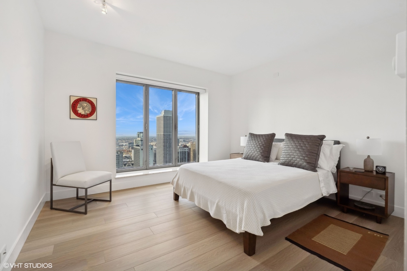 950 North Michigan Avenue, Unit 3404 Chicago, IL 60611 - Photo 21 of 26 a bedroom with a bed and a lamp next to a window
