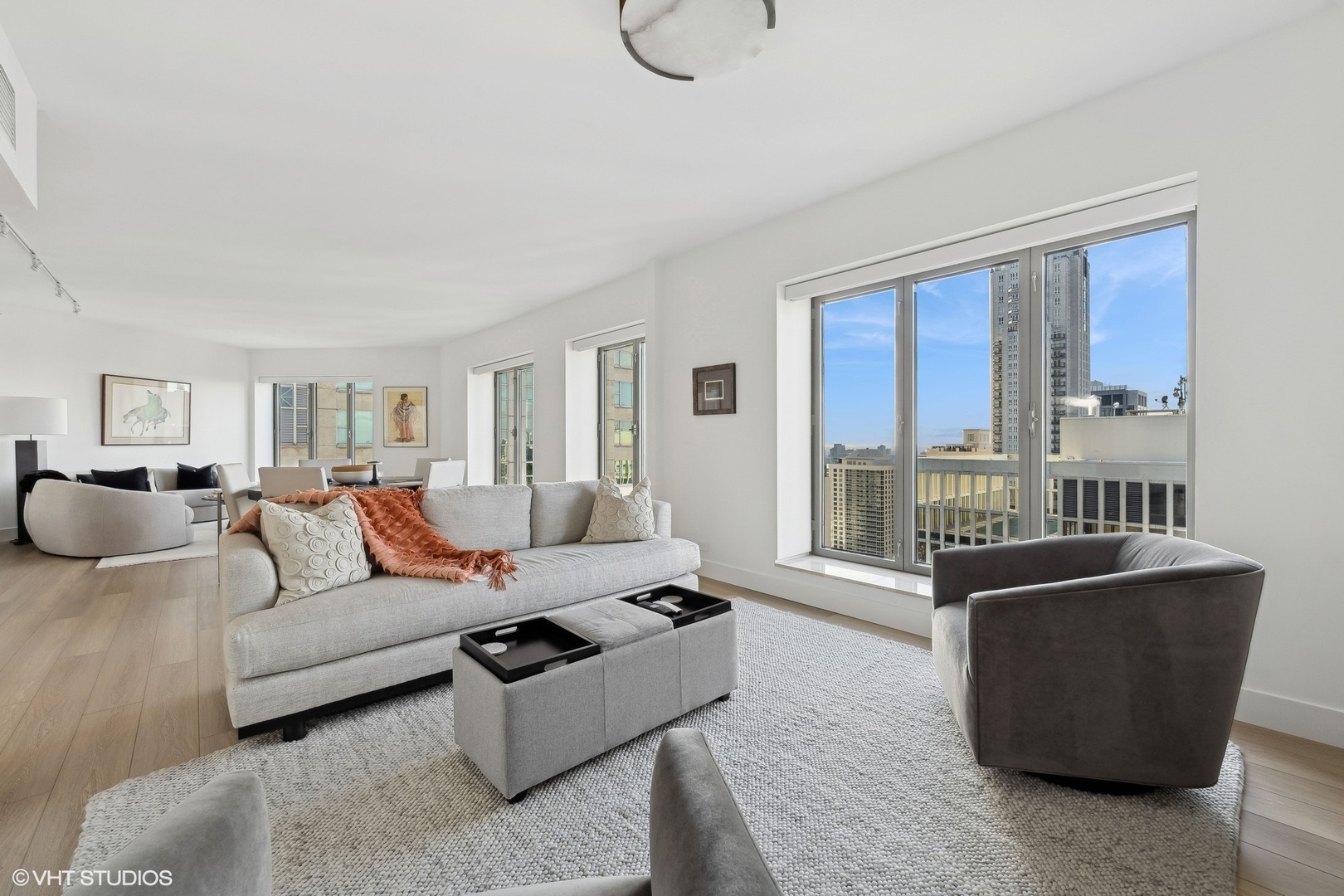 950 North Michigan Avenue, Unit 3404 Chicago, IL 60611 - Photo 5 of 26 a living room with furniture potted plant and a window