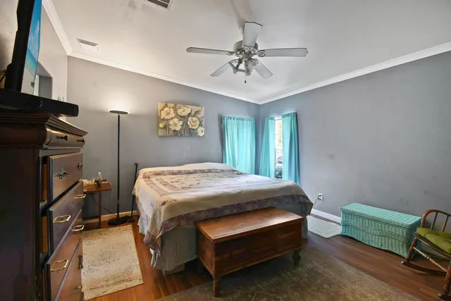 a bedroom with a bed furniture and a window