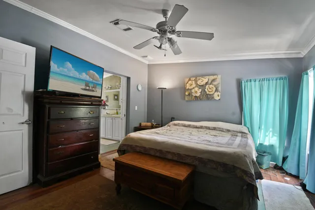 a bedroom with a bed and a dresser