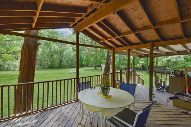 a view of porch with a table and a chairs