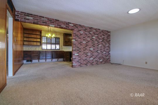 251 West Perdew Avenue Ridgecrest, CA 93555 - Photo 5 of 35 a view of an empty room with a fireplace