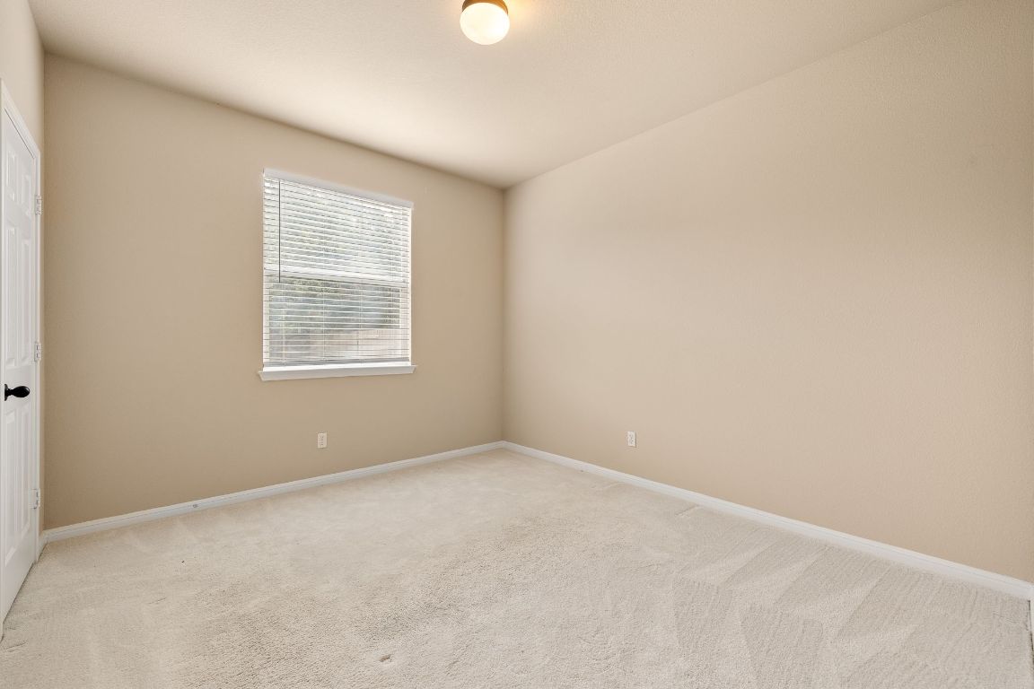 676 Rusk Road Round Rock, TX 78665 - Photo 15 of 35 Downstairs guest bedroom