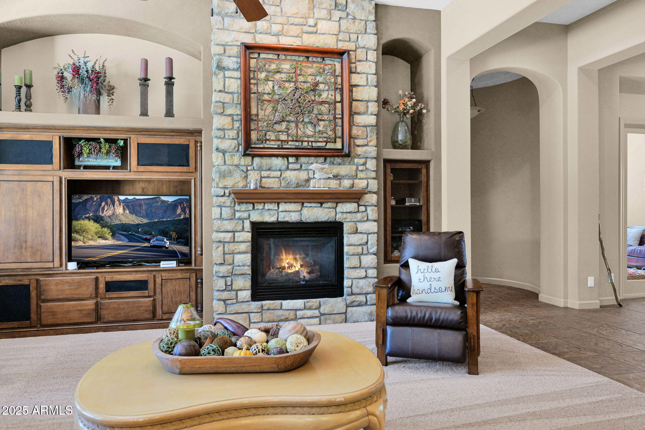 4207 North Arboles Circle Mesa, AZ 85207 - Photo 11 of 71 a living room with furniture and a fireplace