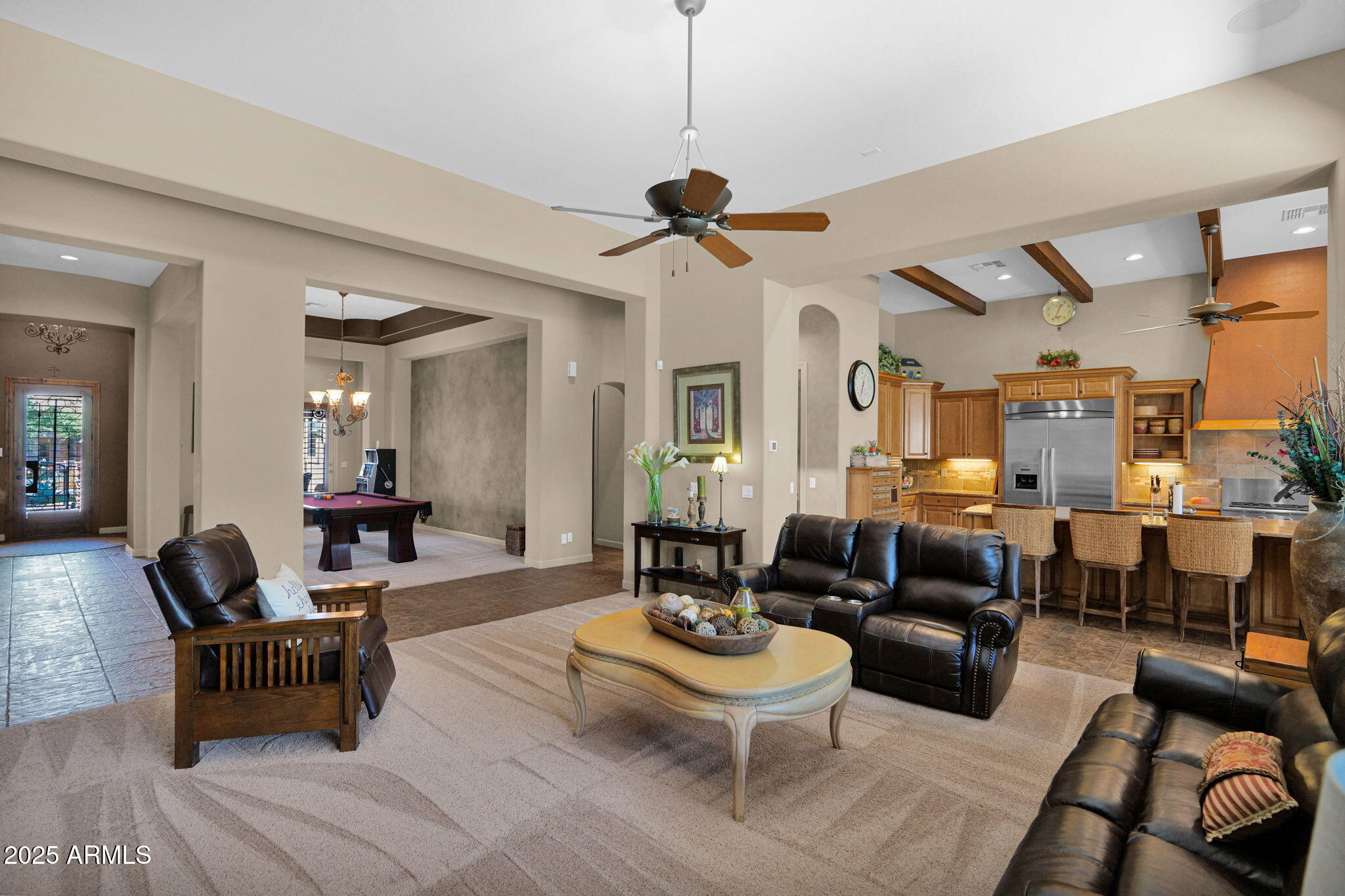 4207 North Arboles Circle Mesa, AZ 85207 - Photo 12 of 71 a living room with furniture a rug and a chandelier