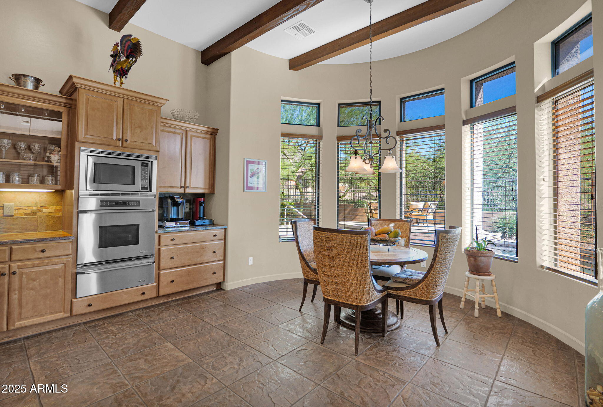 4207 North Arboles Circle Mesa, AZ 85207 - Photo 19 of 71 a dining room with furniture and window