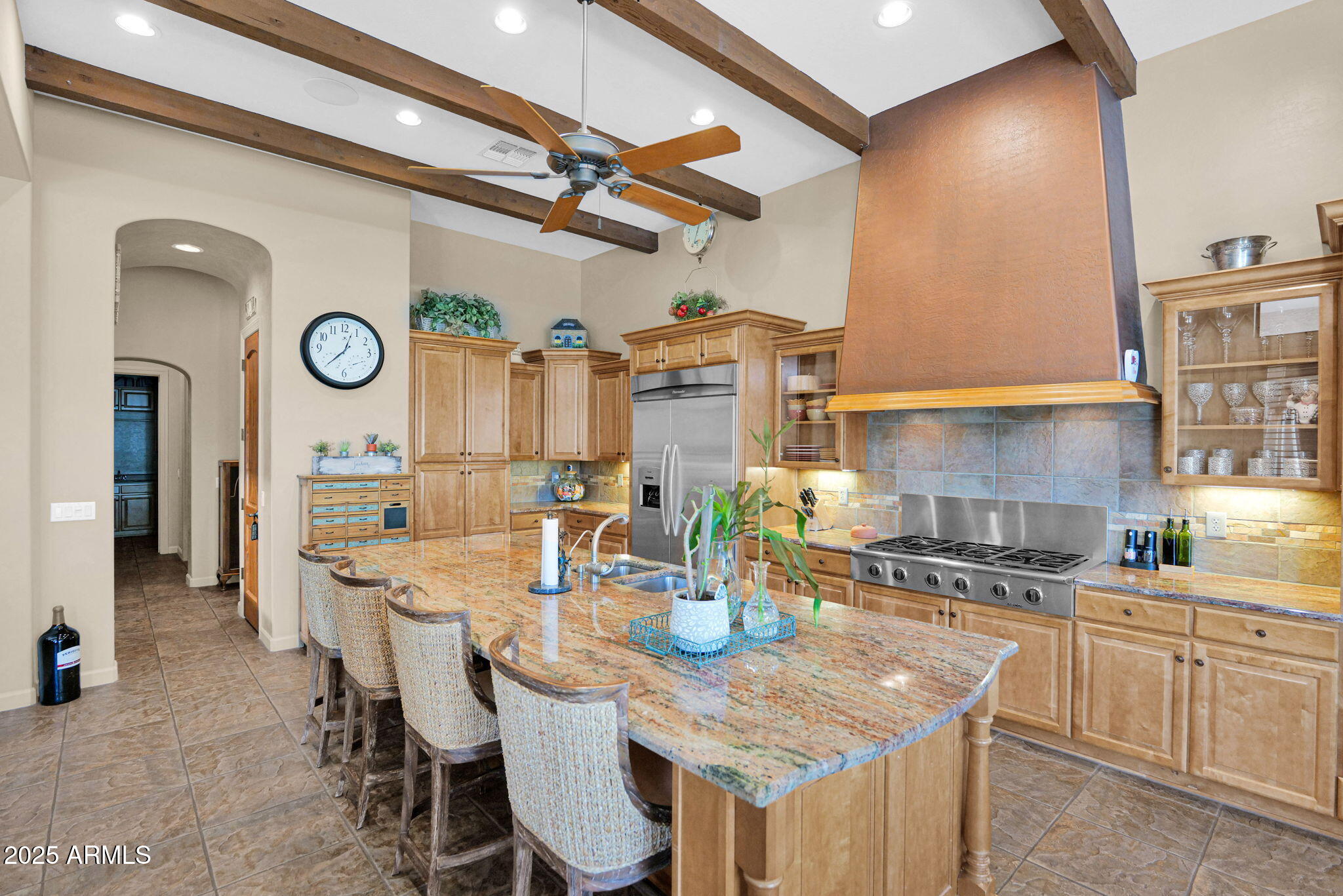 4207 North Arboles Circle Mesa, AZ 85207 - Photo 20 of 71 a kitchen with a table and chairs in it