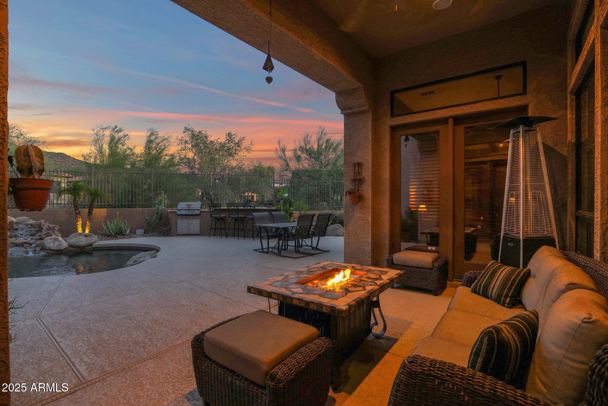 4207 North Arboles Circle Mesa, AZ 85207 - Photo 22 of 71 a outdoor space with patio couch and a potted plant