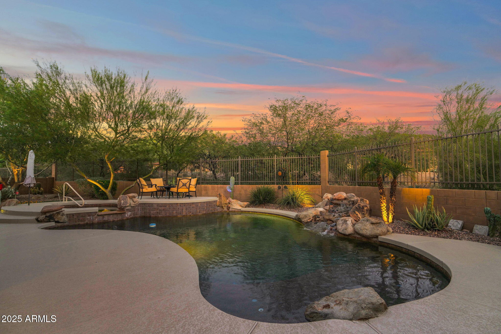 4207 North Arboles Circle Mesa, AZ 85207 - Photo 25 of 71 a view of a swimming pool with a patio