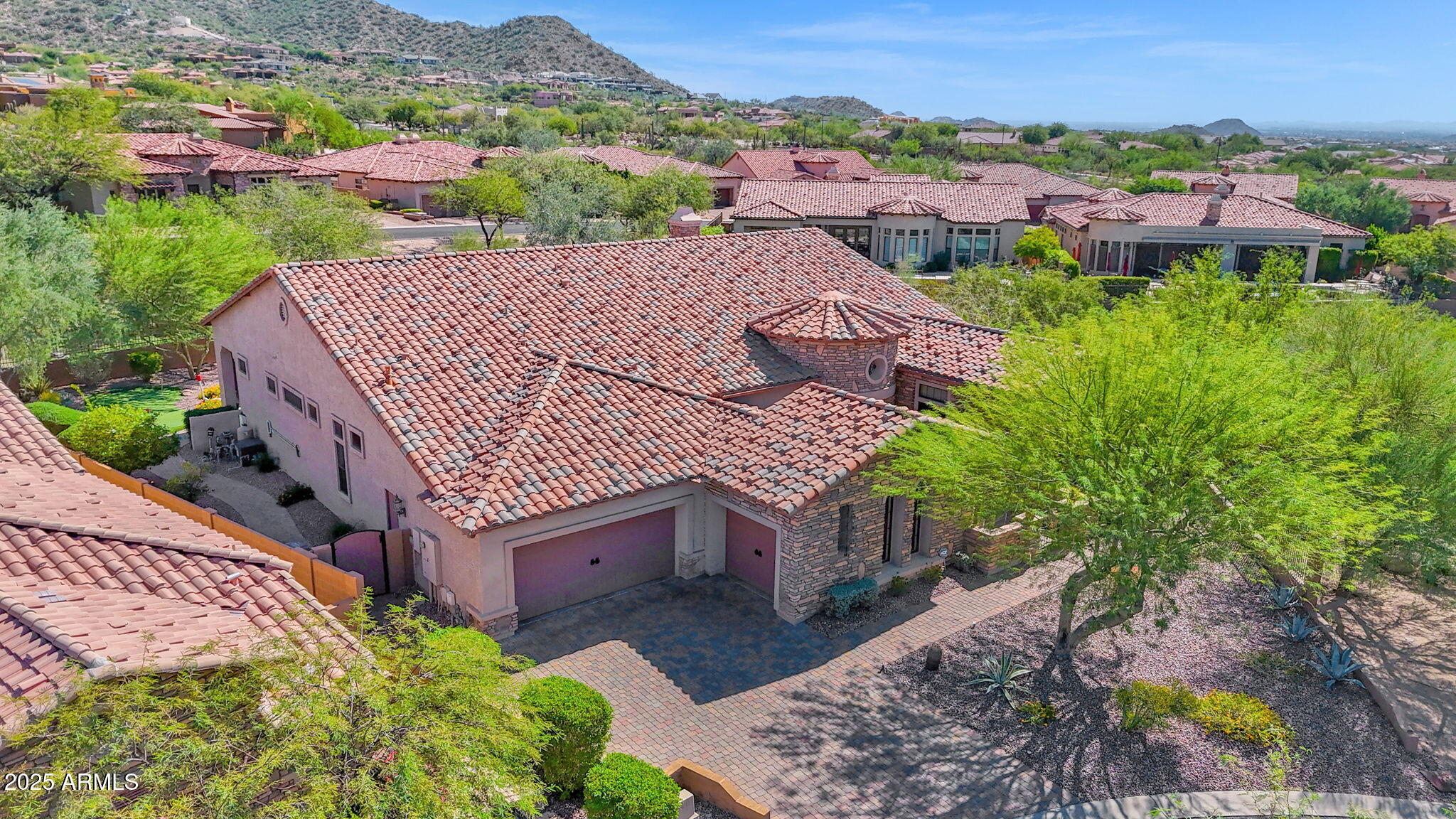 4207 North Arboles Circle Mesa, AZ 85207 - Photo 28 of 71 an aerial view of multiple houses with a yard