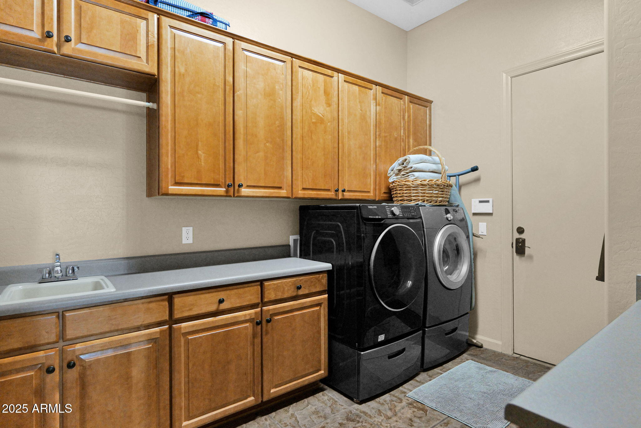 4207 North Arboles Circle Mesa, AZ 85207 - Photo 39 of 71 a utility room with sink dryer and washer