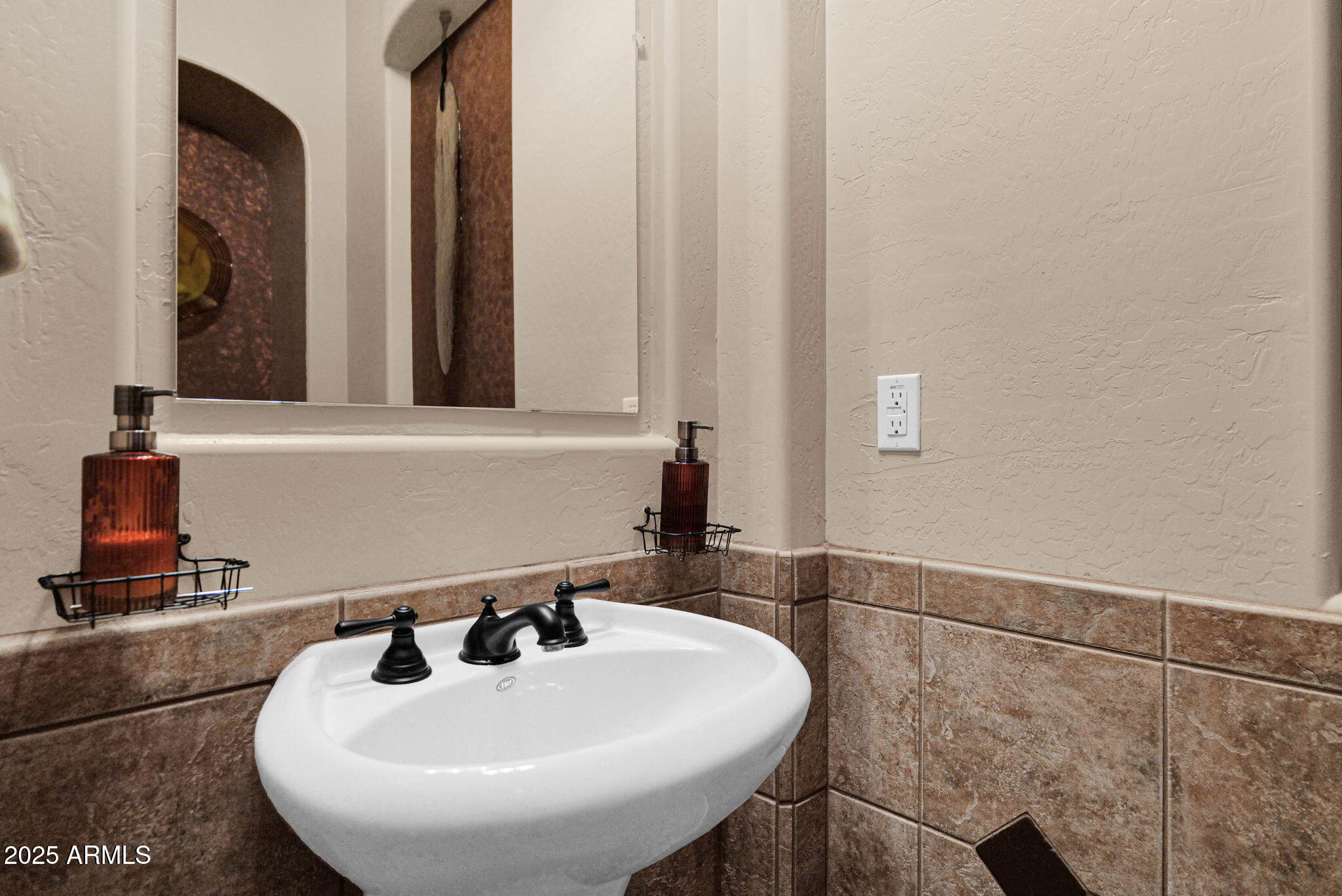 4207 North Arboles Circle Mesa, AZ 85207 - Photo 40 of 71 a bathroom with a sink and a mirror