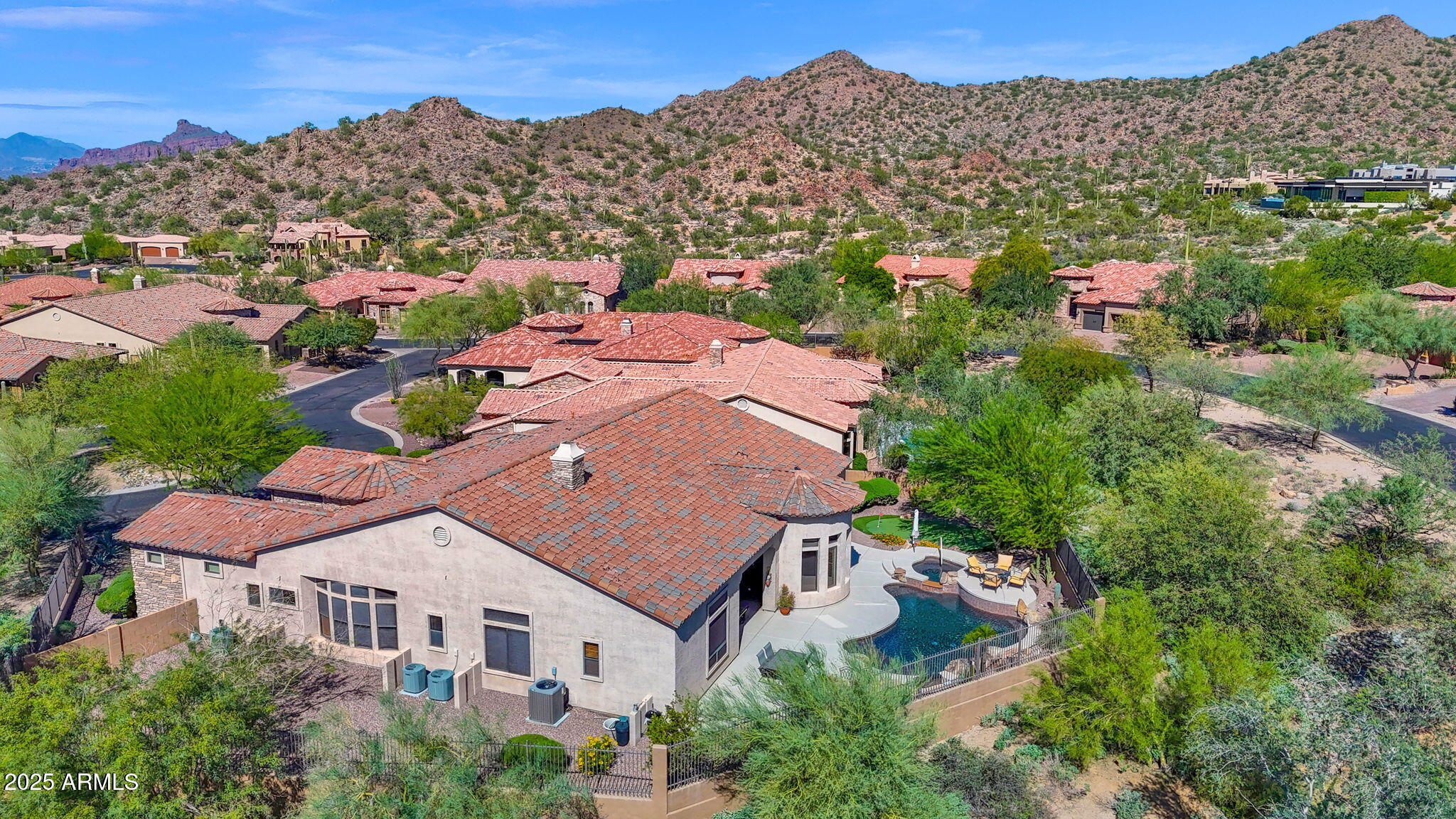 4207 North Arboles Circle Mesa, AZ 85207 - Photo 47 of 71 an aerial view of multiple houses with a yard