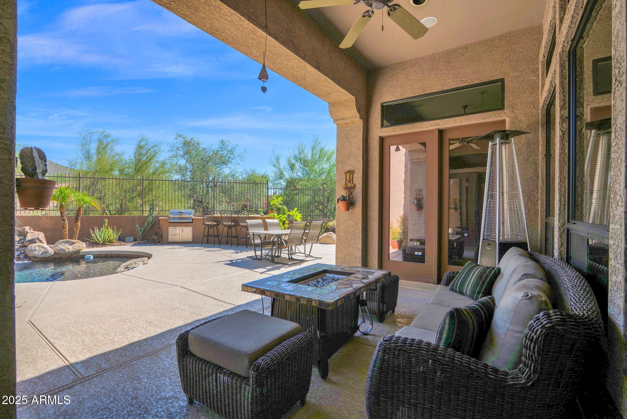 4207 North Arboles Circle Mesa, AZ 85207 - Photo 54 of 71 a outdoor space with patio couches and a potted plant