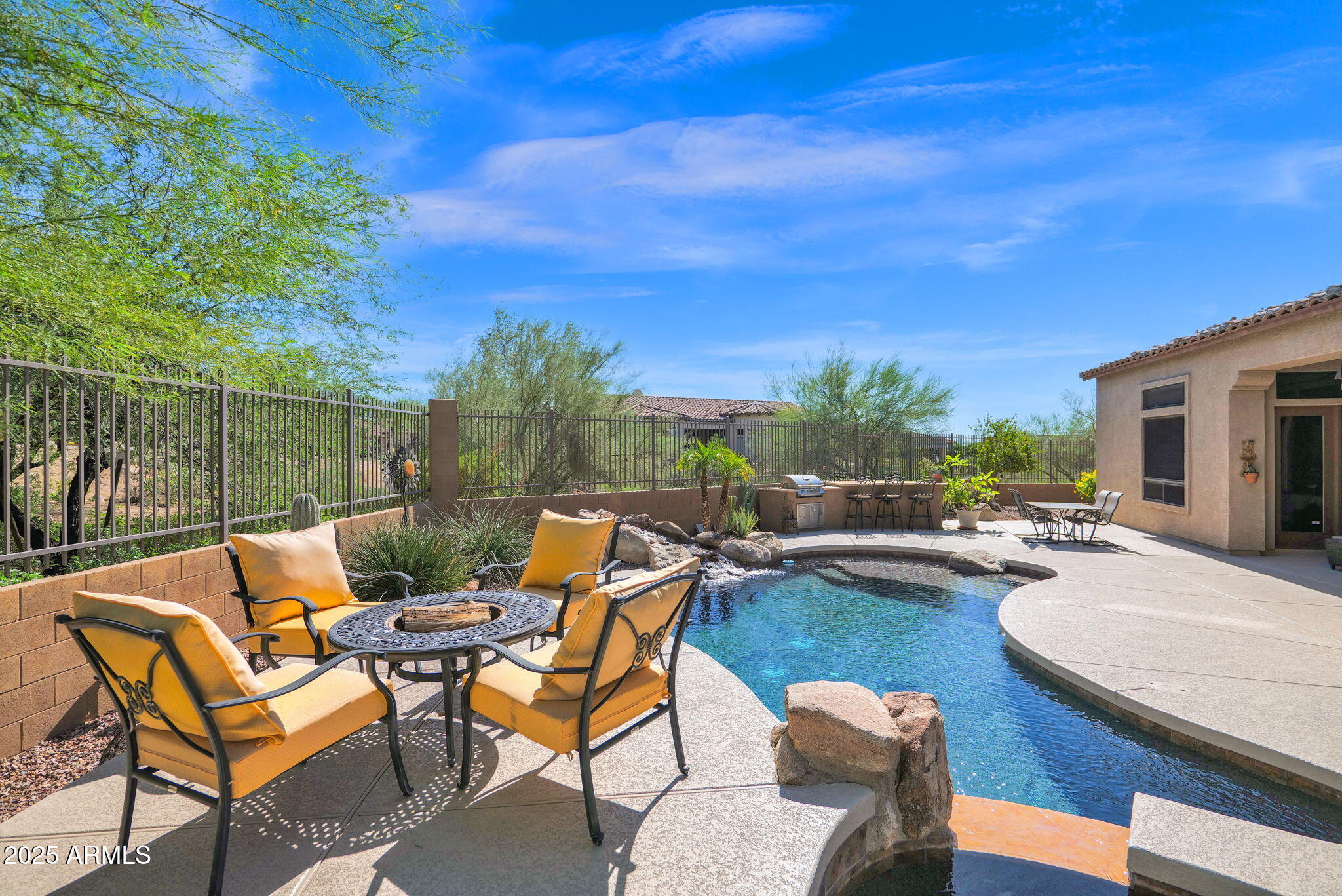 4207 North Arboles Circle Mesa, AZ 85207 - Photo 56 of 71 a view of a patio with swimming pool