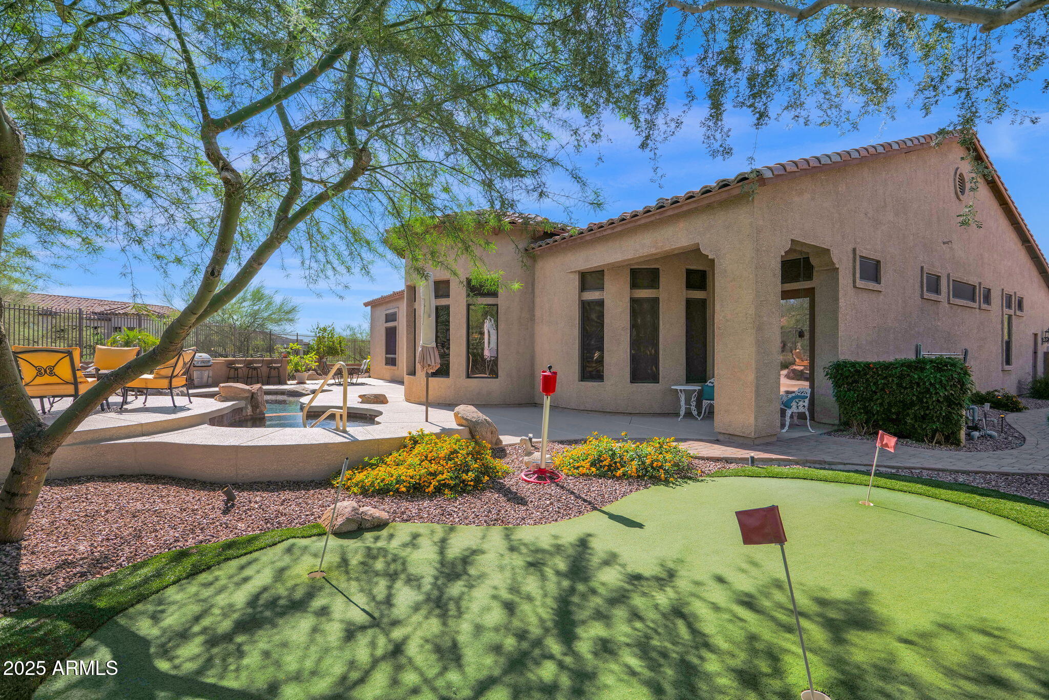 4207 North Arboles Circle Mesa, AZ 85207 - Photo 59 of 71 a view of a house with swimming pool and sitting area