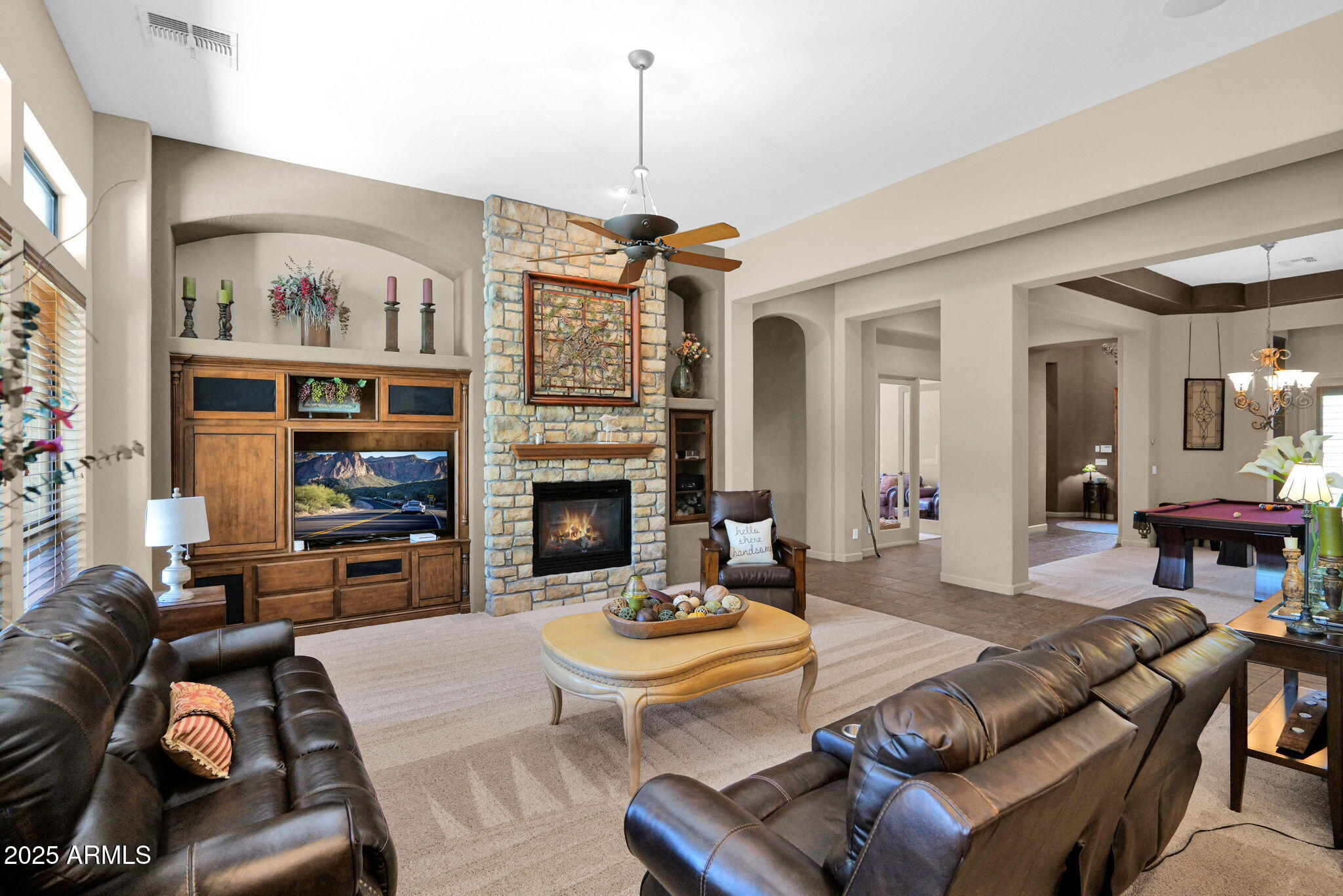 4207 North Arboles Circle Mesa, AZ 85207 - Photo 9 of 71 a living room with furniture fireplace and a table