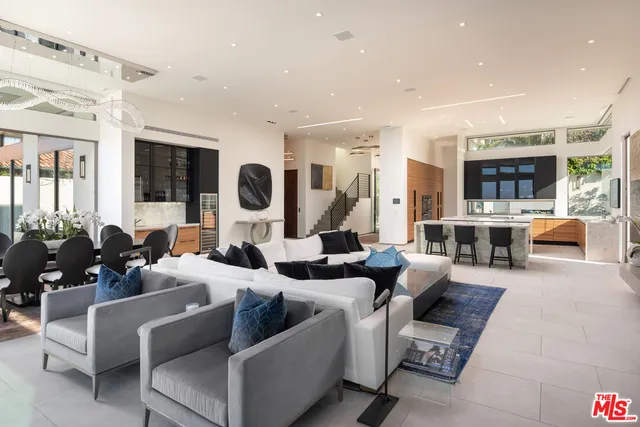 a living room with fireplace furniture and a flat screen tv