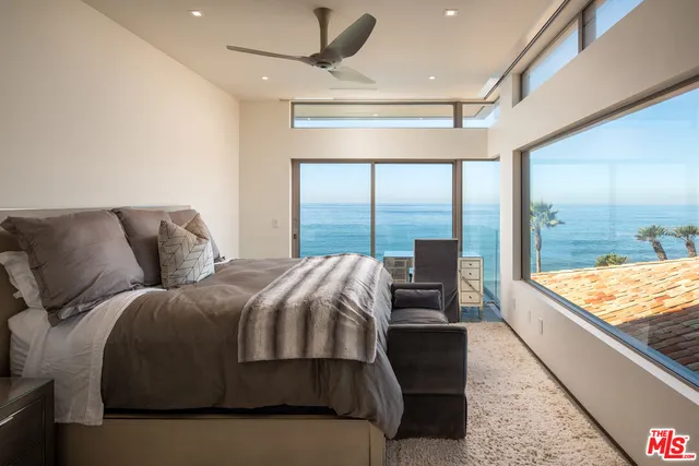a bathroom with a shower and a sink