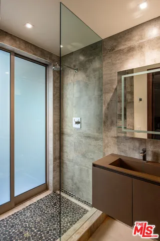 a bedroom with a bed and a television