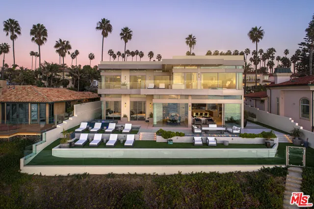 a front view of house with yard swimming pool and outdoor seating