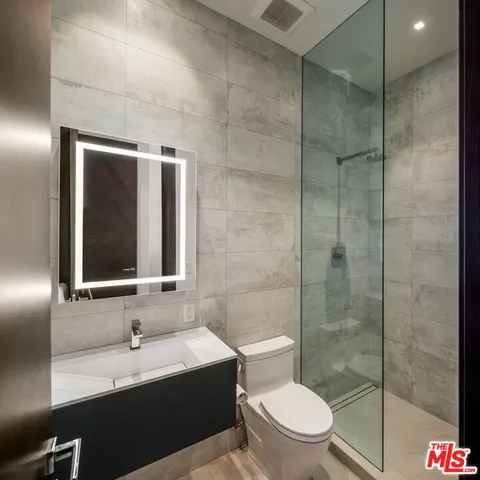 a bathroom with a toilet and a sink