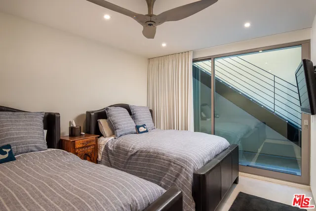 a bathroom with a shower and a sink