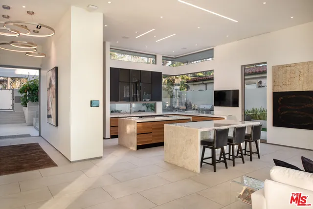 a building outdoor space with patio furniture and potted plants