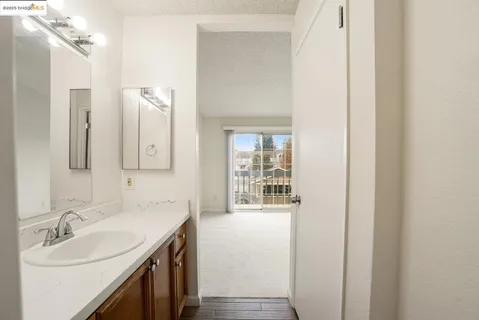 a white toilet sitting next to a shower