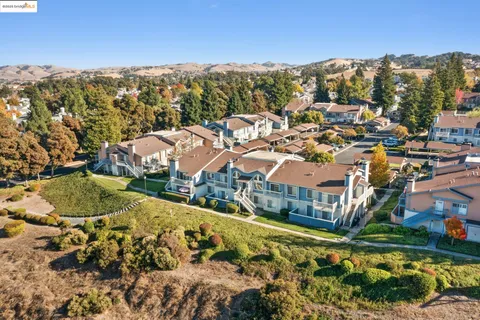 a view of a city with mountains in the background