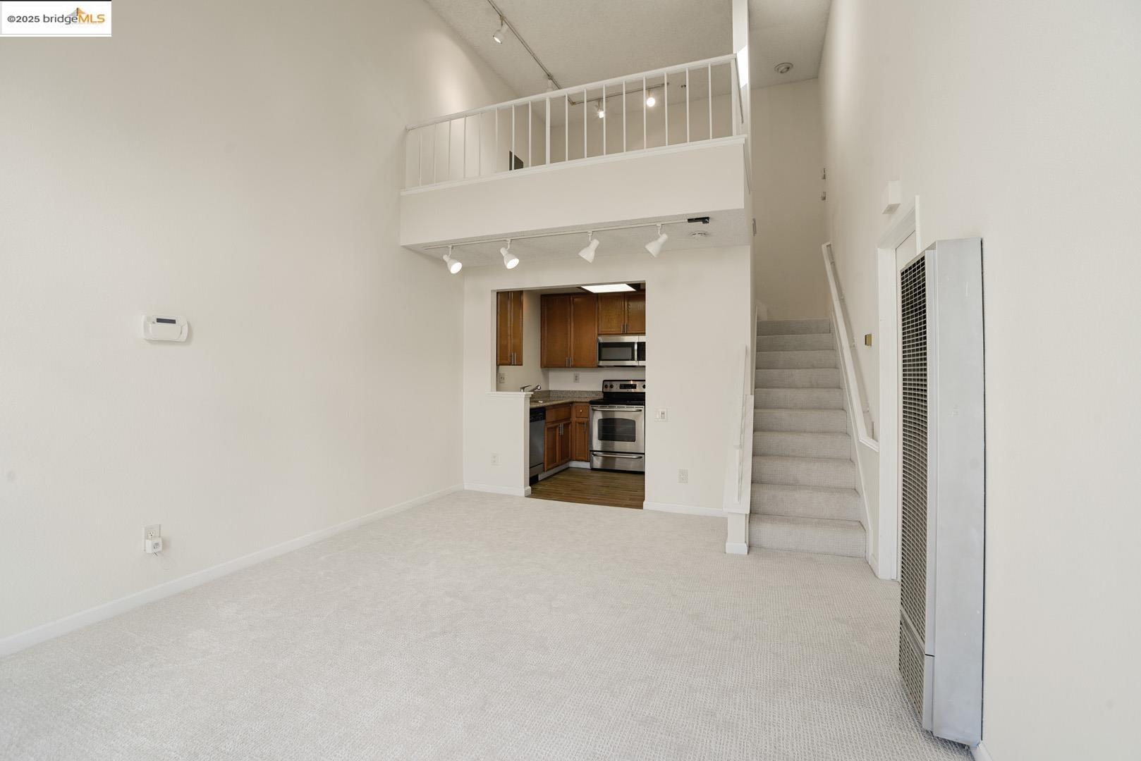 44 Glenwood Hercules, CA 94547 - Photo 6 of 35 an empty room with a fireplace and cabinet