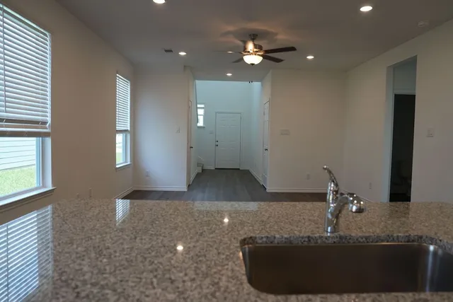 a view of a living room with a sink and chandelier