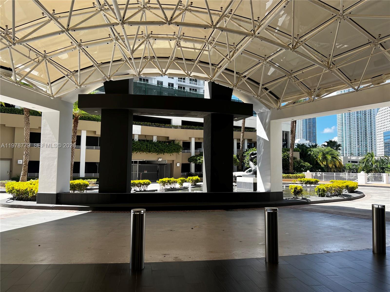 901 Brickell Key Boulevard, Unit 1001 Miami, FL 33131 - Photo 13 of 18 a view of a entryway with a table and chairs