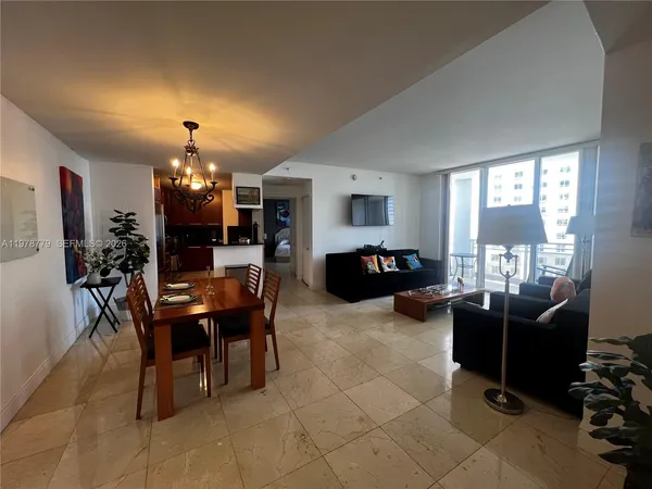 a view of a work space with furniture window and wooden floor