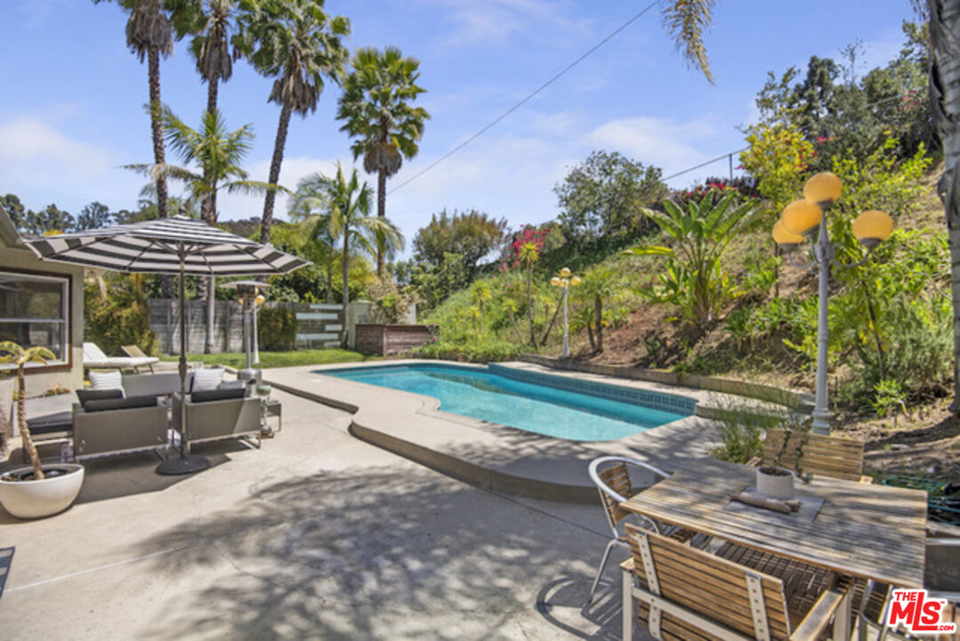8152 Amor Road Los Angeles, CA 90046 - Photo 13 of 27 a front view of a house with a yard