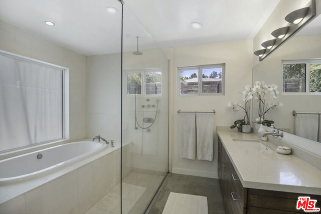 8152 Amor Road Los Angeles, CA 90046 - Photo 14 of 27 a bathroom with a bathtub and a sink
