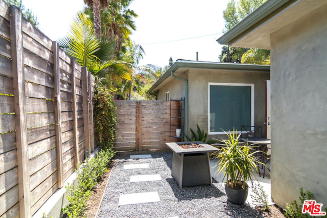 8152 Amor Road Los Angeles, CA 90046 - Photo 18 of 27 a view of a house with a patio
