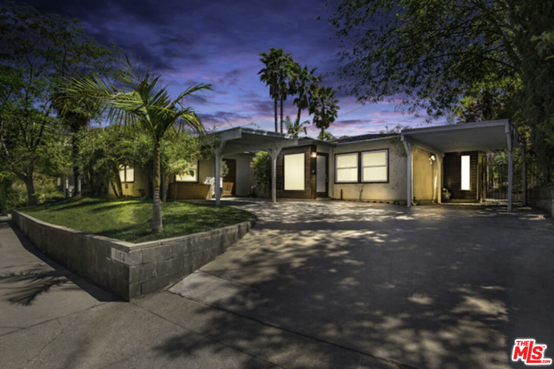8152 Amor Road Los Angeles, CA 90046 - Photo 24 of 27 a front view of a house with garden