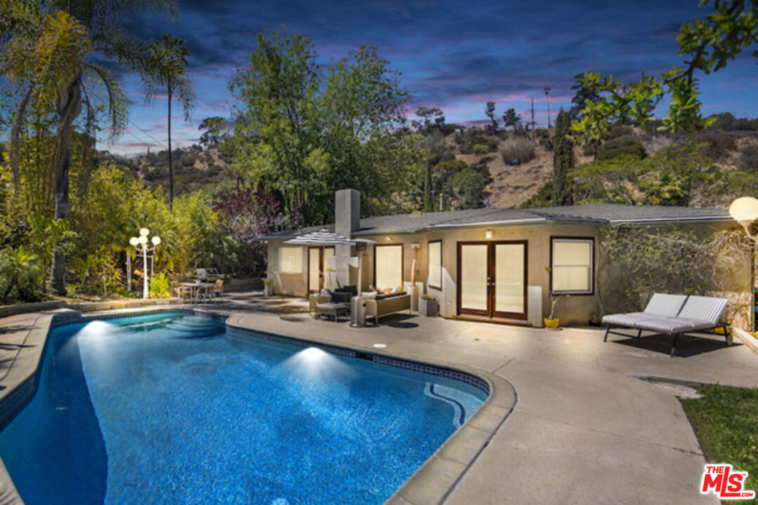 8152 Amor Road Los Angeles, CA 90046 - Photo 25 of 27 a view of a swimming pool with lounge chair