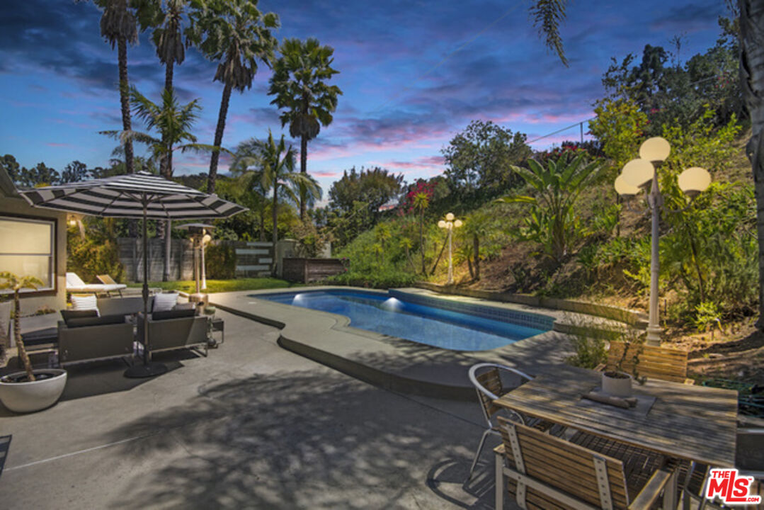 8152 Amor Road Los Angeles, CA 90046 - Photo 26 of 27 a view of patio with table and chairs and potted plants