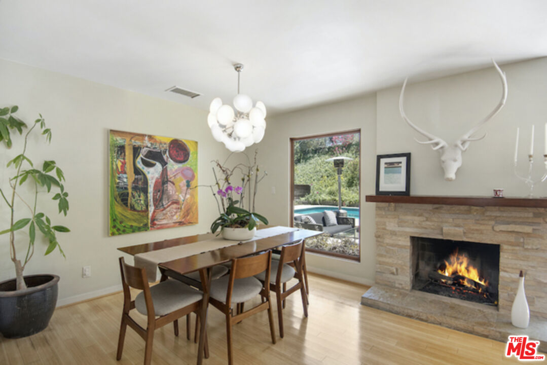 8152 Amor Road Los Angeles, CA 90046 - Photo 5 of 27 a view of a dining room with furniture and chandelier