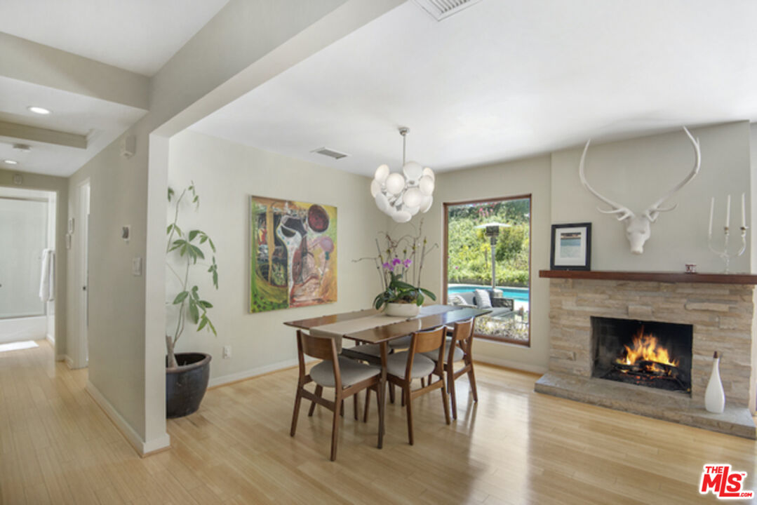 8152 Amor Road Los Angeles, CA 90046 - Photo 9 of 27 a view of a dining room with furniture window and wooden floor