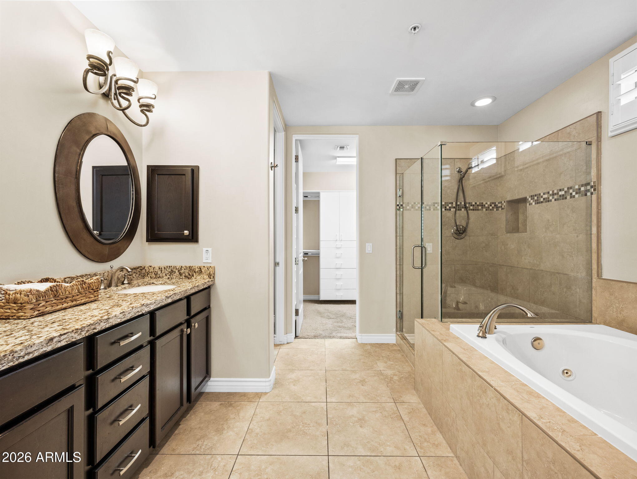 36600 North Cave Creek Road, Unit B14 Cave Creek, AZ 85331 - Photo 13 of 29 a bathroom with a tub a sink and a mirror
