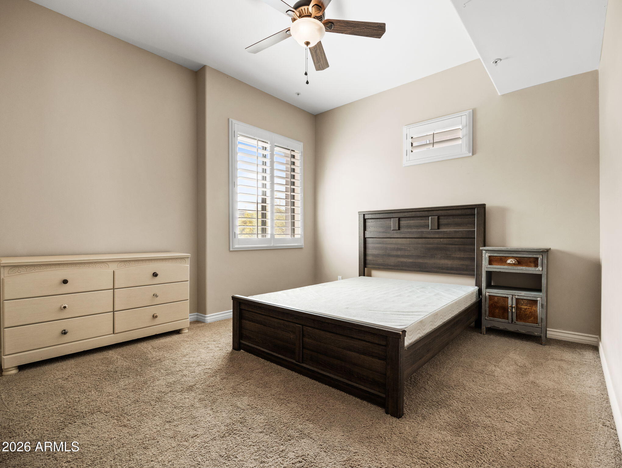 36600 North Cave Creek Road, Unit B14 Cave Creek, AZ 85331 - Photo 18 of 29 a bedroom with a bed and a dresser