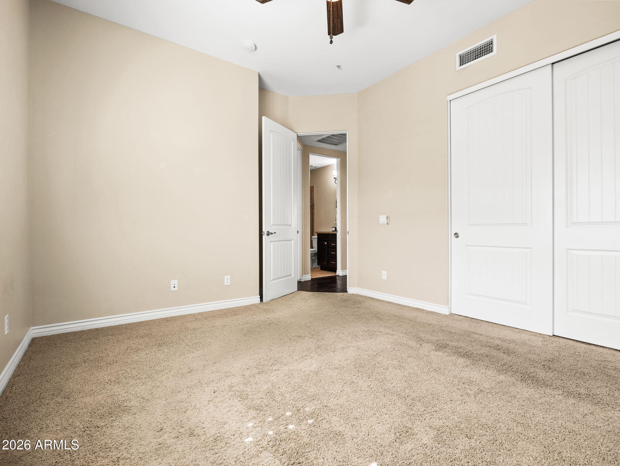 36600 North Cave Creek Road, Unit B14 Cave Creek, AZ 85331 - Photo 22 of 29 an empty room with closet and a chandelier fan