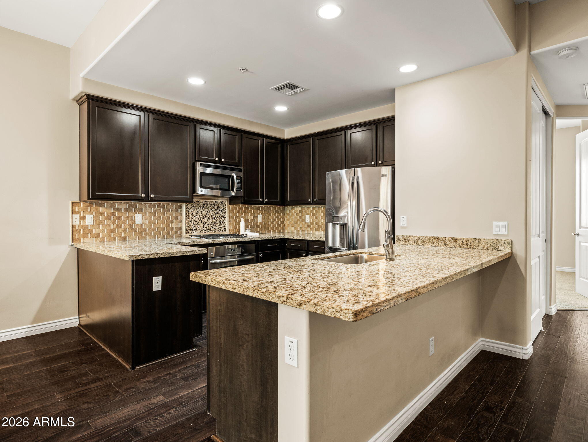 36600 North Cave Creek Road, Unit B14 Cave Creek, AZ 85331 - Photo 5 of 29 a kitchen with stainless steel appliances granite countertop a sink refrigerator and cabinets