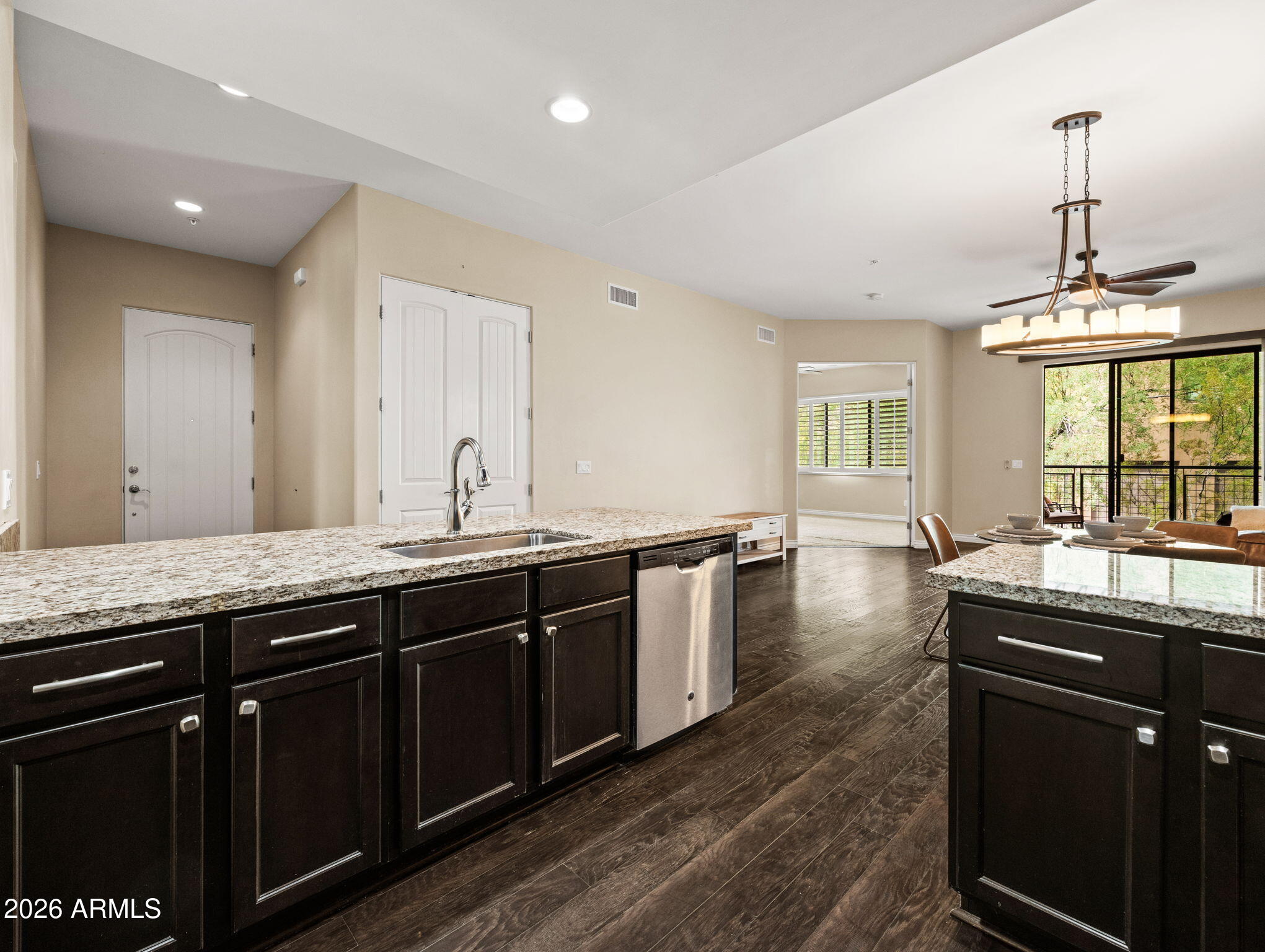 36600 North Cave Creek Road, Unit B14 Cave Creek, AZ 85331 - Photo 7 of 29 a kitchen with granite countertop a sink and cabinets