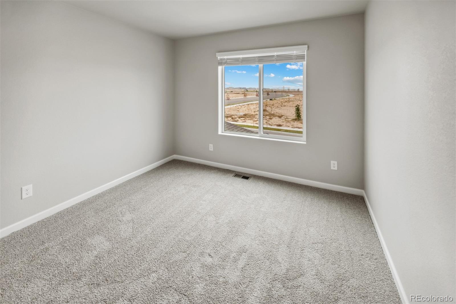 2175 Alyssa Street Fort Lupton, CO 80621 - Photo 13 of 39 an empty room with windows