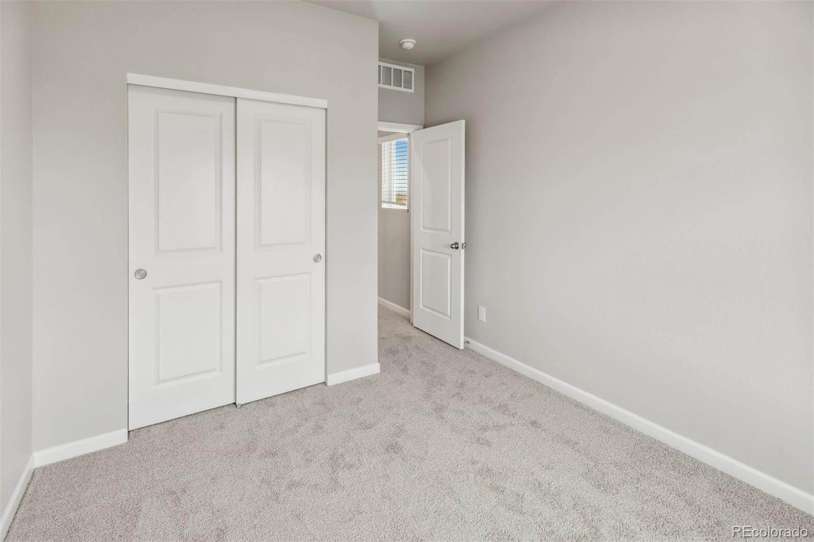 2175 Alyssa Street Fort Lupton, CO 80621 - Photo 7 of 39 a view of an empty room